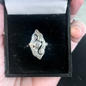 Antique, one of a kind dinner ring. Real Silver with several real diamonds.